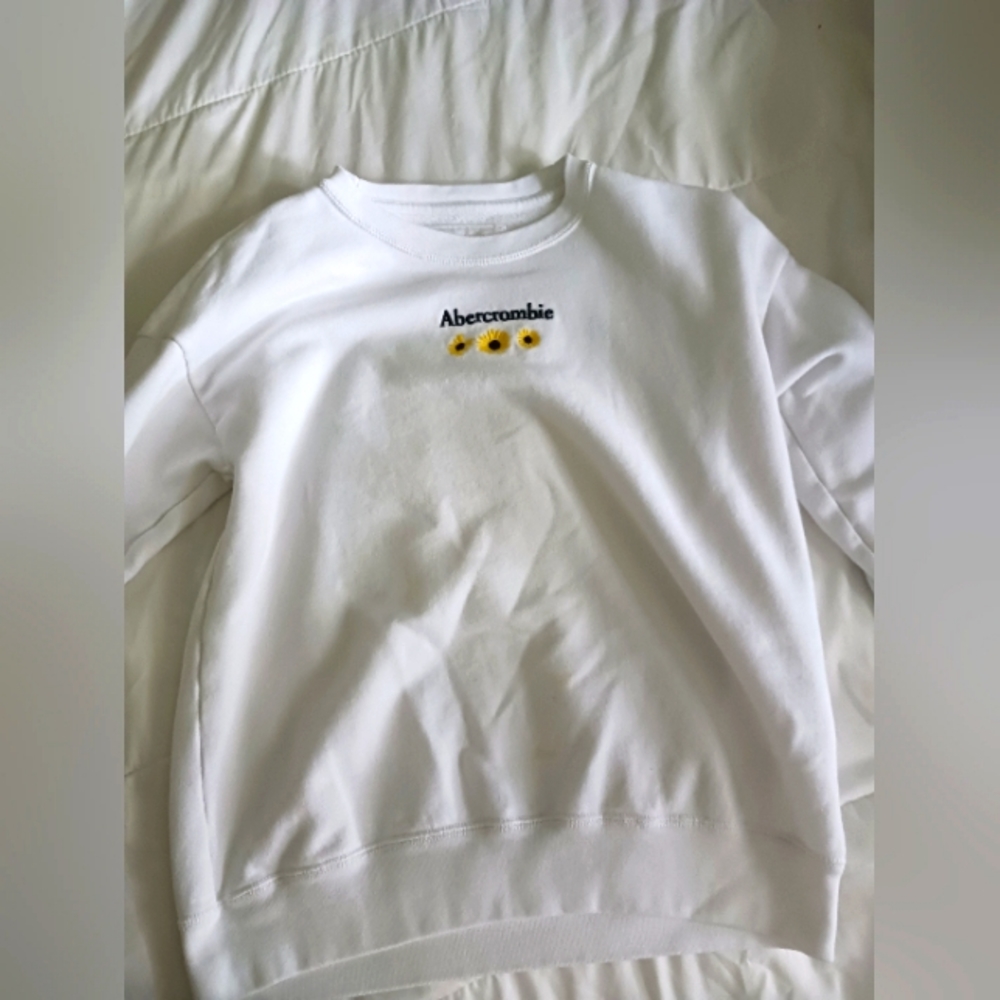 white sweatshirt with sunflowers